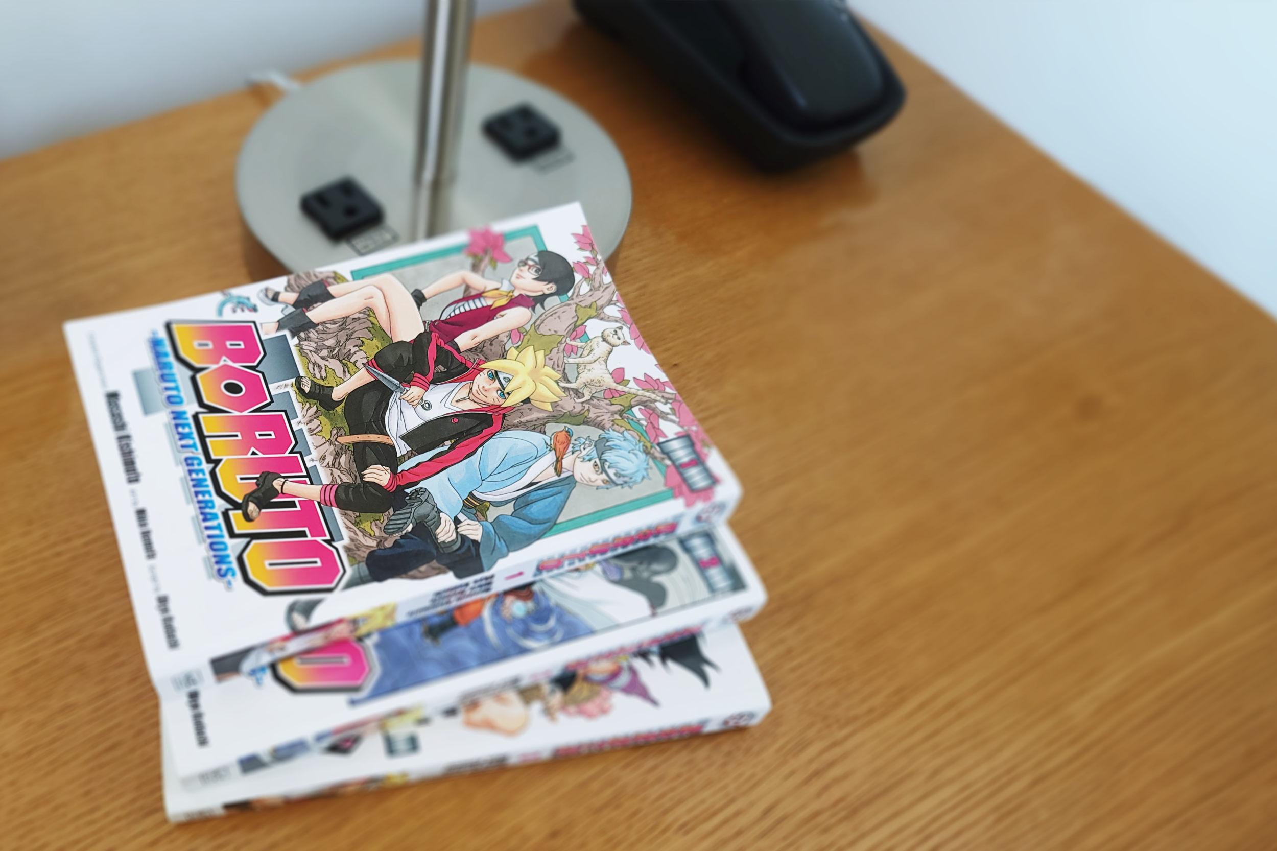 boruto naruto next generation manga volumes on desk