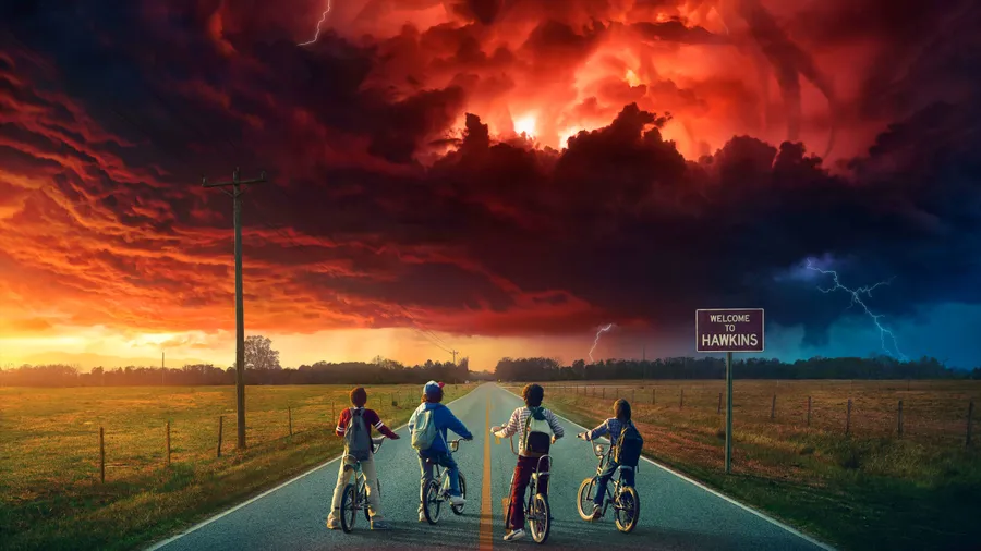 stranger things welcome to hawkins four characters on bikes looking at cloudy red sky