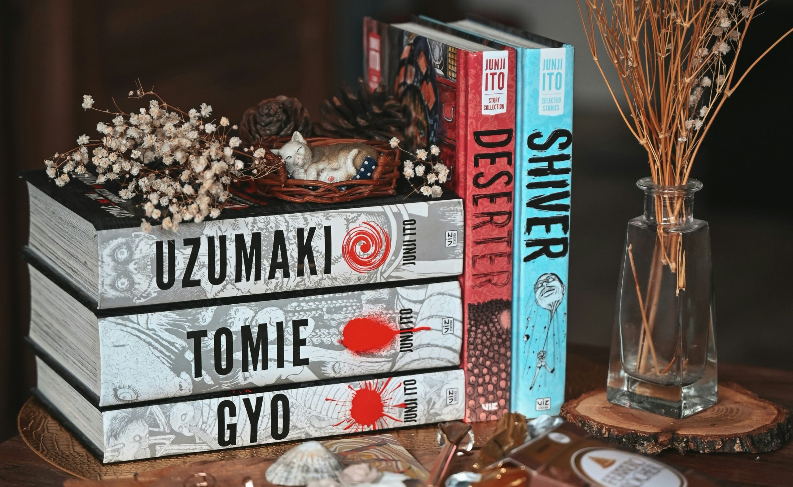 photo of junji ito's books uzumaki, tomie, gyo, shiver, and deserter on a table