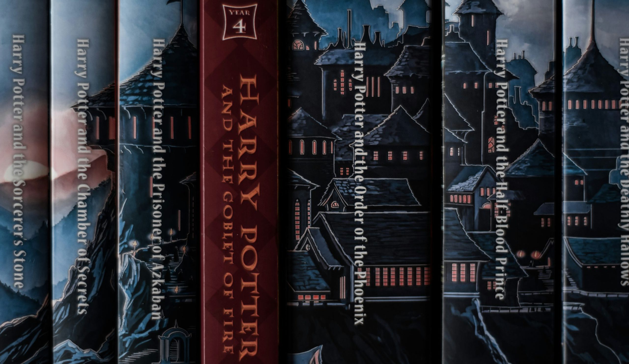 harry potter complete book series lined up with titles visible