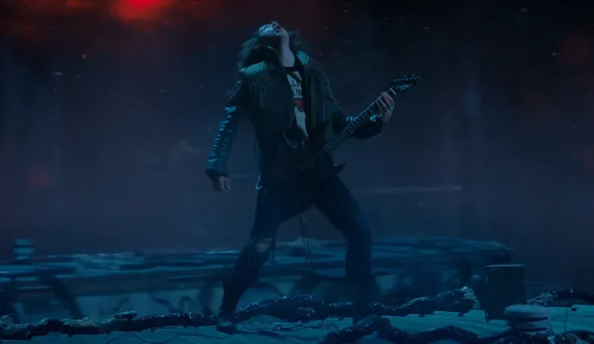 eddie-munson-playing-the-guitar-in-stranger-things-1cr4fa6n6z4r1we2 stranger things netflix season 4 eddie munson playing guitar in the upside down metallica master of puppets