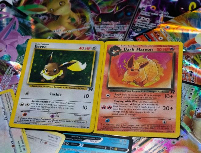 halfcut-pokemon-sKp3JAklWac-unsplash Pokémon trading card game cards two cards on top of a pile of cards